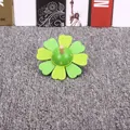 Vibrant green flower-shaped wooden whistle toy for early childhood musical education - Flower Spinning Top / Green