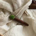 Elegant vintage brown suede duckbill hair clip decorated with a green fuzzy pom-pom - Flocked Green Ball Teardrop Hair Clip / Brown and Green