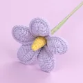 Beautiful handmade purple crochet flower with yellow center on a light background - Plumeria Branch / Purple