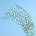 Hand-knitted crochet white jasmine flowers with green stems on blue background - Snow Willow Branch / Blue