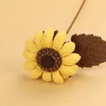 Handmade crochet sunflower decoration with yellow petals and brown knitted leaf detail - Afghan Cream Sunflower / Light Yellow