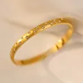 Close-up of gold titanium steel starry bangle with small star-shaped crystals. - Gold Starry Sky