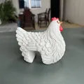 Detailed macro view of a white artistic resin hen figurine for garden fence decor - White