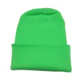 Vibrant neon green knit beanie hat with classic ribbed texture for winter warmth and style - Fluorescent Green