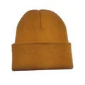 Detailed close-up of a mustard yellow winter knitted beanie with soft ribbed texture - Caramel color