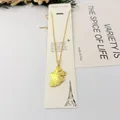 Vue détaillée d'un collier avec pendentif feuille de ginkgo en acier inoxydable doré - Style Feuille de Ginkgo / 40cm+6cm