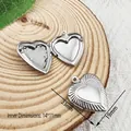Macro detail of heart-shaped stainless steel locket showing inner and outer dimensions - Starburst Pattern Heart Style (YY031)