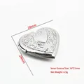 Detailed macro view of heart-shaped stainless steel photo locket with size measurements - Relief Floral Heart Style (YY005)
