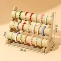 Expositor de pulseras de lino de 3 niveles, 30 cm de ancho y 23,5 cm de alto. - Beige