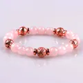 Natural pink crystal bead bracelet with rose gold textured metal accents - Rose Quartz and Rose Gold Lava Stone