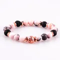 Handmade pink natural stone and black lava bead bracelet featuring rose gold spacers - Pink Zebra and Lava Stone