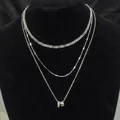Elegant triple-layered silver chain necklace with a circular ring pendant detail - Rhinestone Inlaid Cylinder 3-Piece Necklace Set / Silver