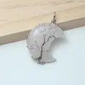 Close-up of handmade wire-wrapped tree of life on rose quartz crescent moon pendant - Rose Quartz