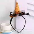 Close-up detail of Halloween witch hat headband featuring orange spider web pattern - Orange and Black Spider Web Style