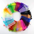 Detailed view of colorful organza drawstring bags arranged in a vibrant circular pattern - Mixed Colors; 5*7cm