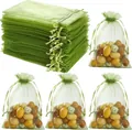 Detailed view of translucent green organza drawstring gift bags with decorative fill - Military Green; 7*9cm