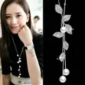 Elegant long silver necklace featuring sparkling pavé leaves and three lustrous pearls. - Pearl Leaf Necklace (010)