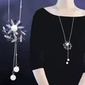 Detail of rotating snowflake long sweater chain necklace with blue crystals and pearls - Blue Crystal Flower Style (138)