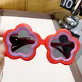 Cute red flower-shaped fashion sunglasses for kids with colorful trim and dark lenses - Red