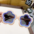 Cute flower-shaped children's sunglasses in beige with blue and purple accents. - Beige
