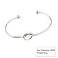 Silver finish open cuff bracelet with minimalist knot detail and end ball accents - Style 4 Silver