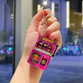 Mini electroplated slot machine keychain in vibrant pink finish with working lever toy - Las Vegas Style / Pink