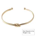 Elegant gold-tone alloy open cuff bracelet featuring a chic center knot design for women - Textured Knot (Style 8 Gold)