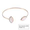 Elegant gold-tone open cuff bangle featuring leaf-shaped white stones and rhinestones - Style 13 Gold