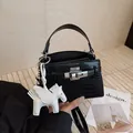 Fashionable black crocodile pattern Kelly style handbag with cute white horse charm - Black