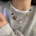 Vibrant colorful beaded necklace featuring metallic flower and heart charms for women - Anagallis
