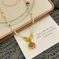 Elegant pearl beaded necklace with colorful enamel elephant pendant design - Artificial Pearl Elephant