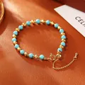 Elegant blue turquoise bead bracelet with gold plated textured accents and adjustable chain - Blue Turquoise Bracelet