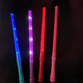 Set of four-color LED glow sticks for concerts and parties on a black background - Purple Medium Stick