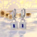 Elegant silver lock drop earrings with pave crystals and blue enamel center detail - Silver