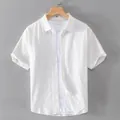 Premium white short-sleeved Oxford cotton shirt for men displayed on a hanger - M / White
