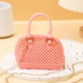Elegant mini pink PVC jelly shell bag featuring pearl texture and gold chain shoulder strap - Pink