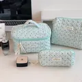 Three-piece set of mint green quilted cosmetic bags with heart pattern for travel storage - Mint Polka Dot