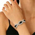 Elegant silver adjustable bracelet featuring black oval gemstones and sparkling pavé crystals - Black Gemstone Intertwined Style (WG-0783)