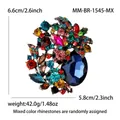 Elegante spilla a fiore con strass colorati e un grande cristallo blu centrale - Oro Antico-Multicolore 1545-MX