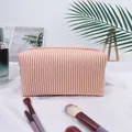 Seersucker striped makeup bag with orange and white patterns for travel storage - Orange (Regular Zipper)