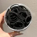 Large pack of durable high elasticity black hair ties stored in a clear circular plastic jar - 15# Black Large Size (Outer Dia Approx 3.5cm)