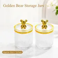 Set of 2 clear ribbed glass storage jars with decorative golden bear knobs and lids - Gold Bear - Clear