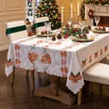 Elegant white rectangular Christmas tablecloth with festive bell embroidery and lace edge. - A Pair of Christmas Bells