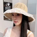 Elegant beige straw sun hat for women with a delicate white lace ruffle brim for beach vacations - Knitted Bucket Hat Khaki