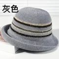 Elegant grey woven sun hat with decorative striped band for beach and summer travel - Striped Curled Gray