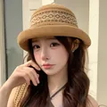 Stylish brown knitted bucket hat with white geometric pattern for summer beach sun protection. - Wavy Curled Edges Khaki