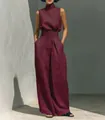 Full body shot of a model wearing a burgundy cotton-linen set in a sunny outdoor setting - Burgundy