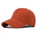 Close-up detail of a vintage terracotta faux suede baseball cap on a white background - Adjustable / Orange