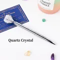 Elegant silver metal ballpoint pen topped with a natural clear quartz raw stone. - White Crystal Raw Stone (6186451919090)