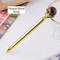 Elegant golden metal ballpoint pen topped with a natural dragon blood jasper stone orb - Dragon Blood Stone Sphere Style (6186451919092)
